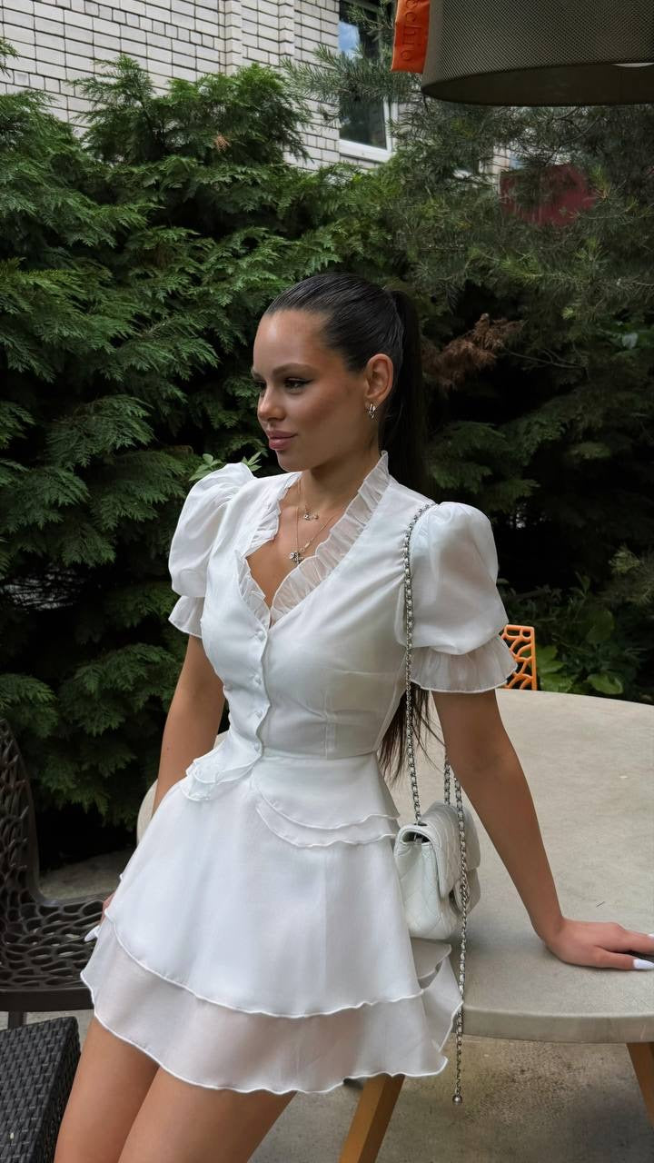 Blouse & Skirt Set: white ruffle-neck puff-sleeve blouse with tiered mini skirt, worn with a white chain bag